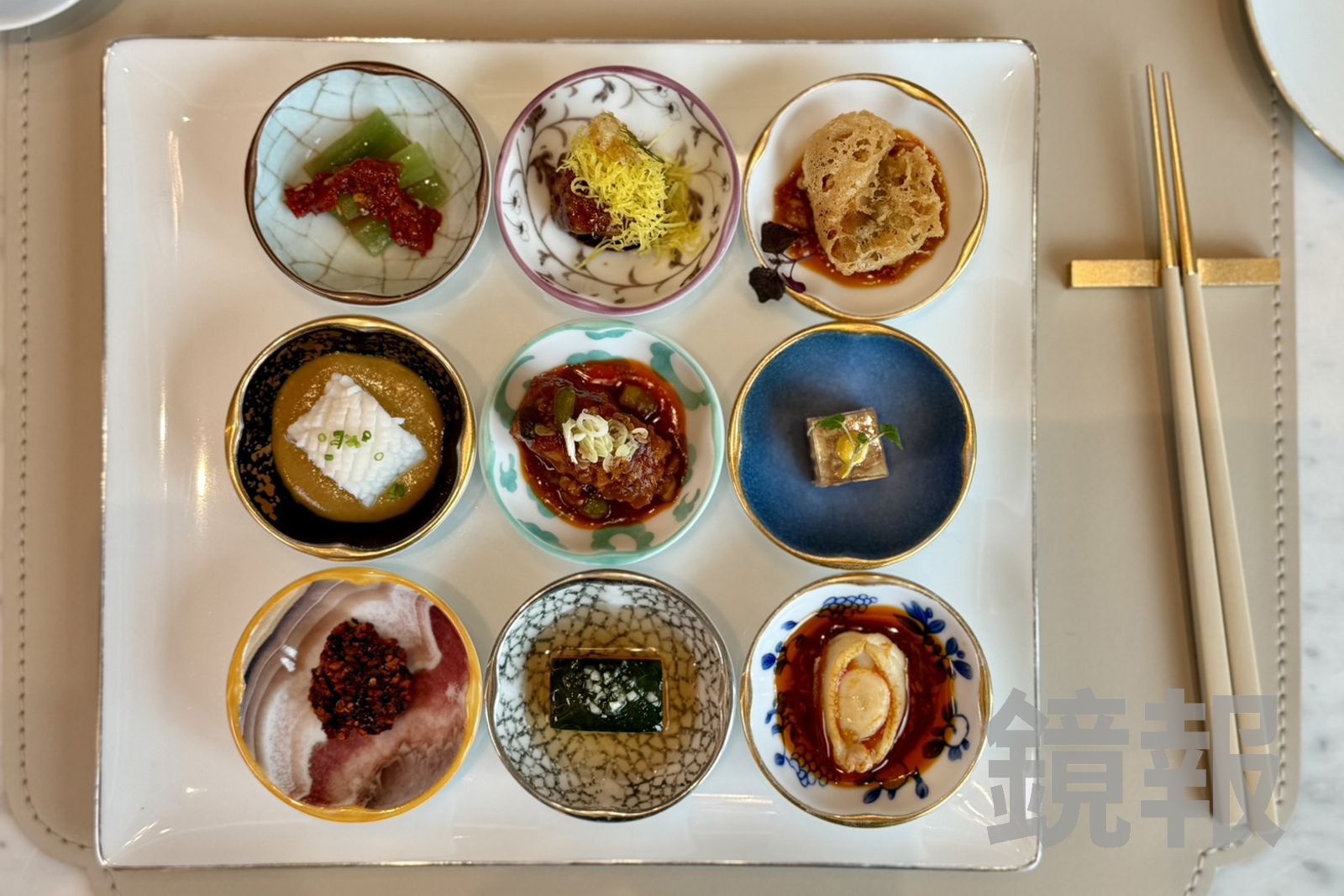 「涼菜九宮格」一次集結9種風味,酸、辣、麻、鮮交錯,繽紛擺盤也成為開席亮點。