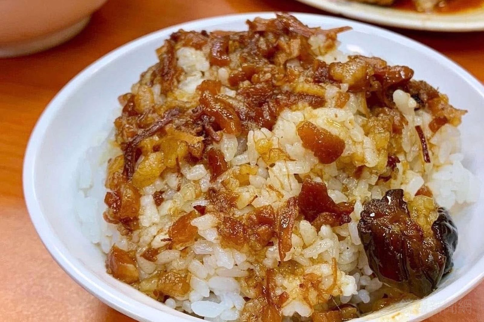 「黃記魯肉飯」滷肉肥瘦各半,有南部的甜味。