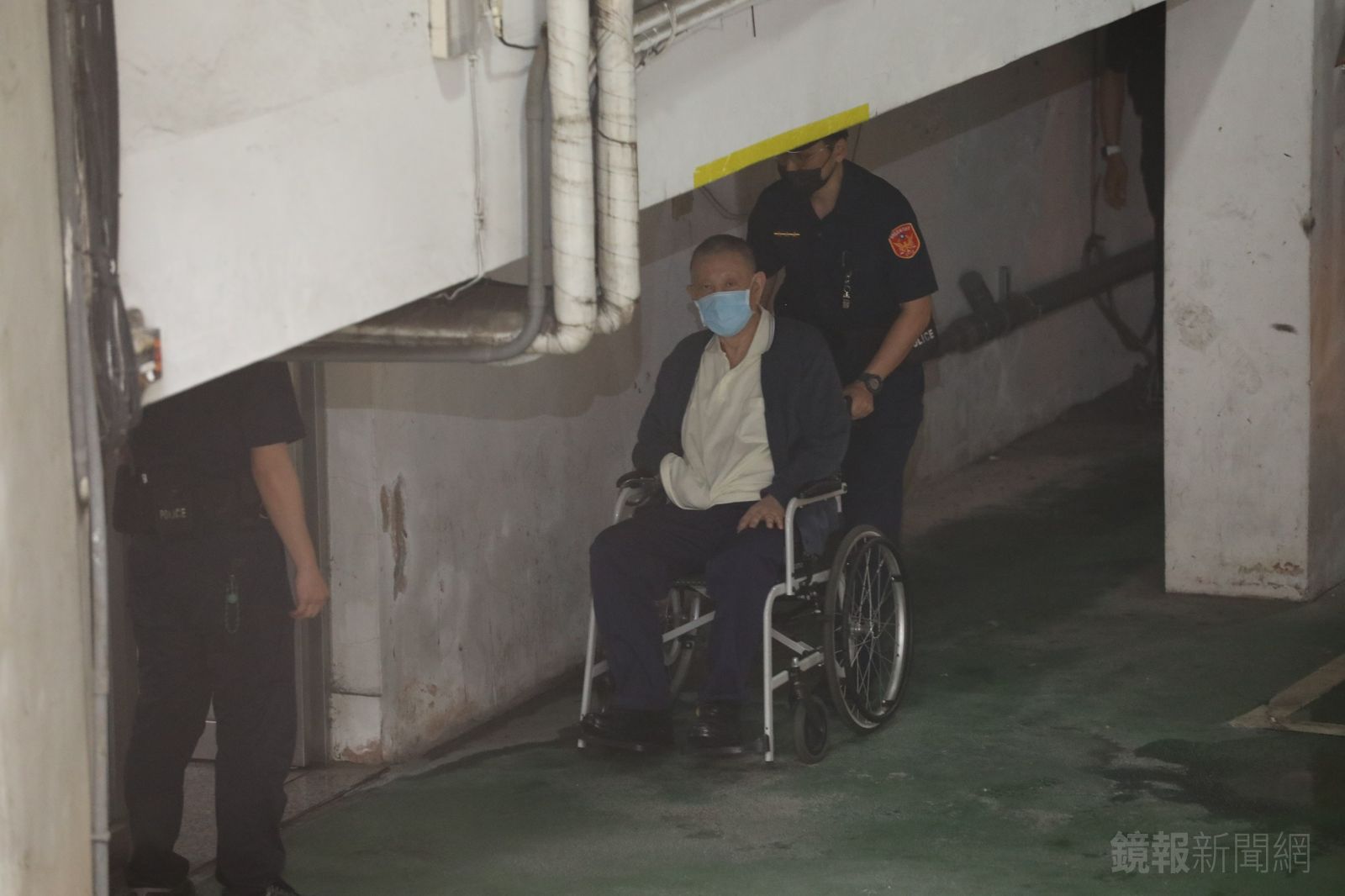 沈慶京坐輪椅出庭。攝影姜永年