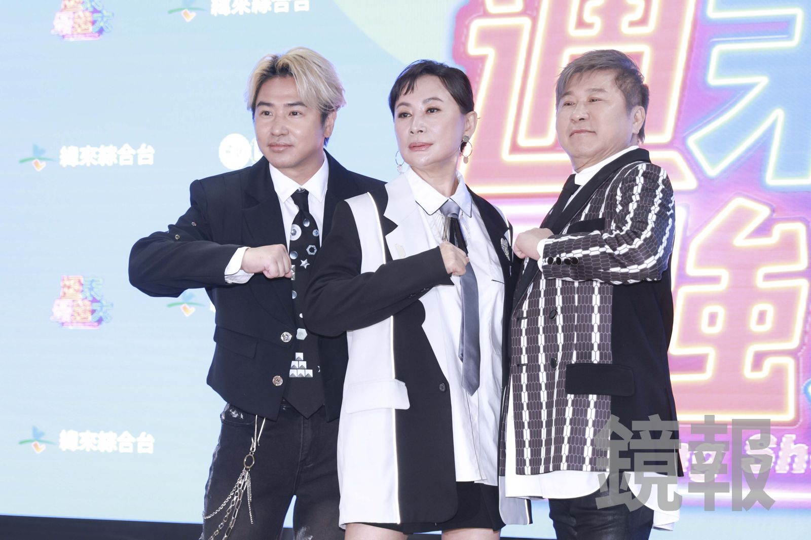 歐力(左)一起主持節目,表示「家有兩寶」。劉耀勻攝